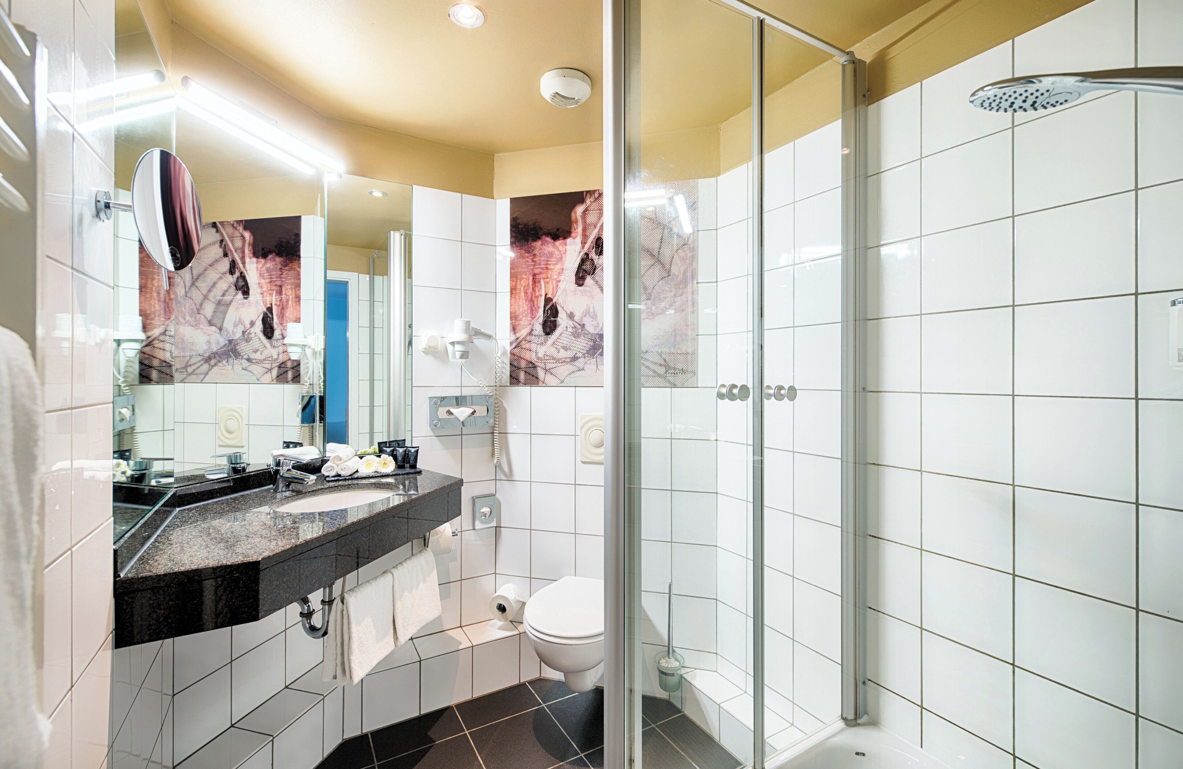 eco-friendly toiletries, hair dryer, towels