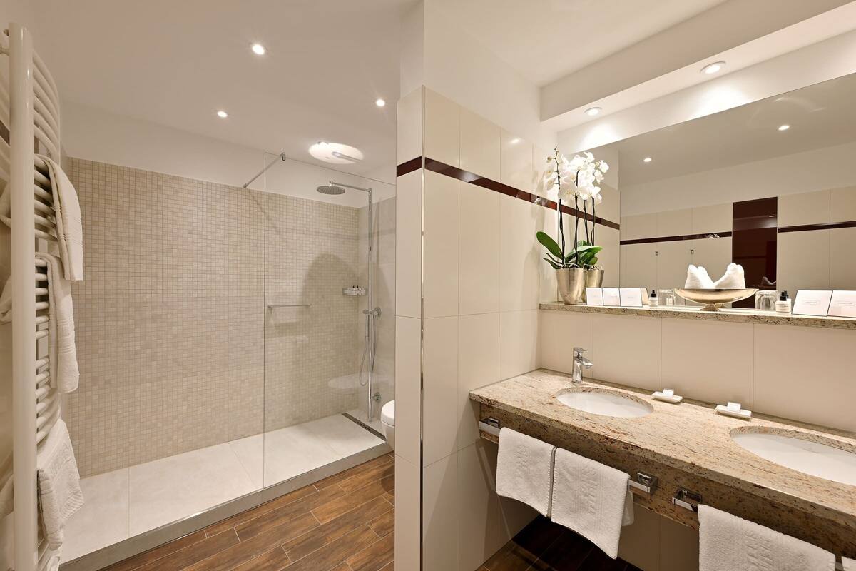 junior suite double room | bathroom | shower, eco-friendly toiletries, hair dryer, bathrobes