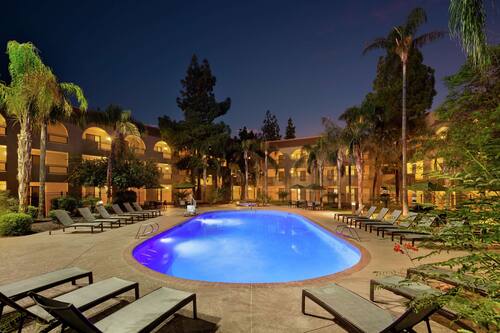 Outdoor pool, pool umbrellas, sun loungers