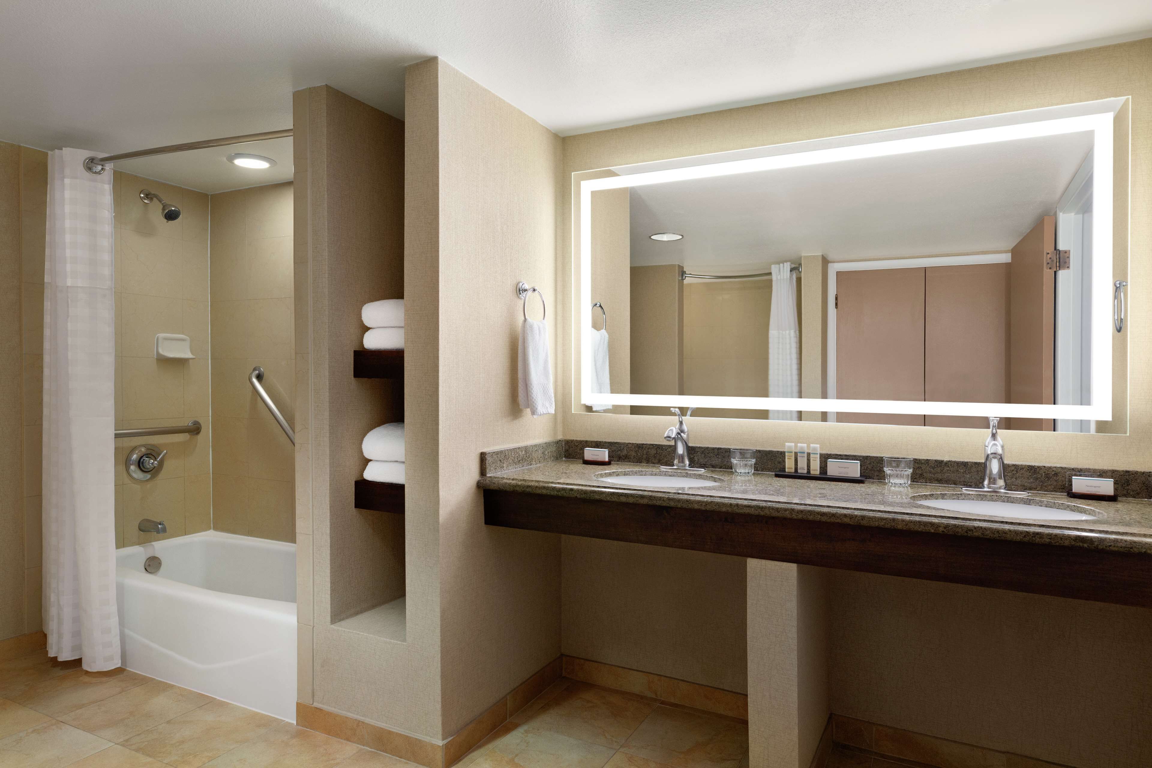 suite, 2 double beds, accessible (mobility & hearing, roll-in shower) | bathroom | combined shower/bathtub, designer toiletries, hair dryer, towels