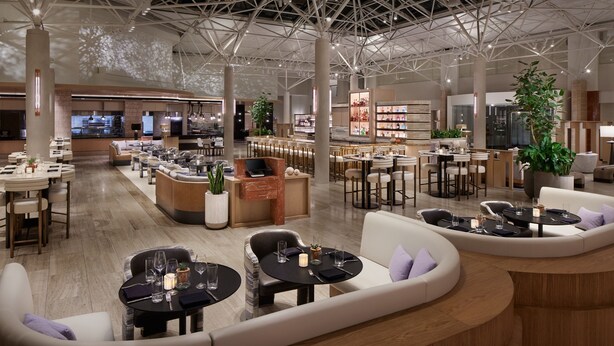 A spacious hotel lobby with multiple seating areas, a bar, and a restaurant. - The Westin DC Downtown (Washington)