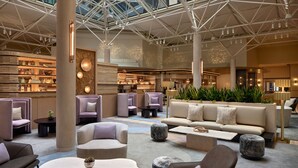 A spacious lobby with modern seating, a bar area, and a high ceiling with a geometric design. - The Westin DC Downtown (Washington)