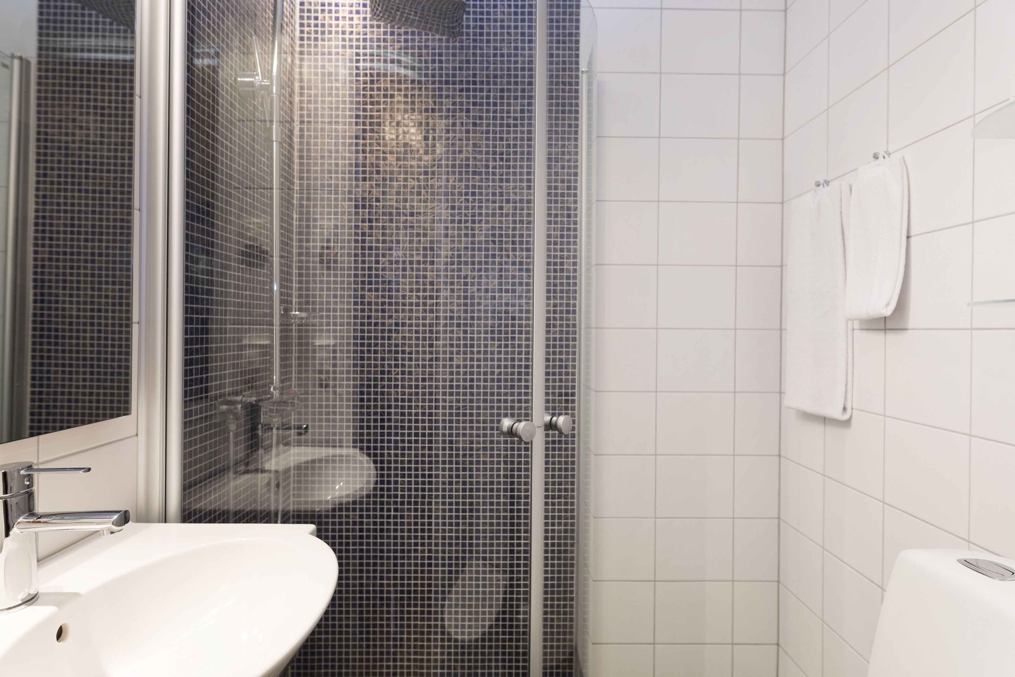 rainfall showerhead, eco-friendly toiletries, hair dryer, towels