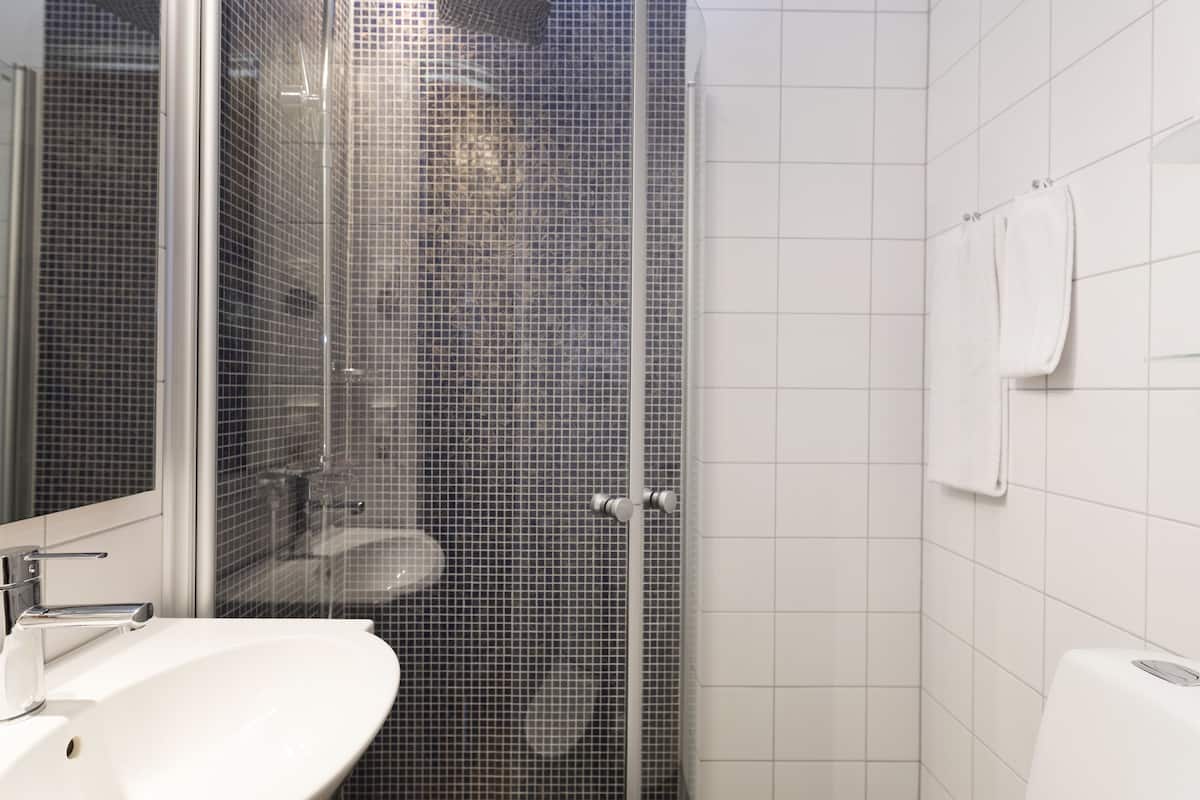 rainfall showerhead, eco-friendly toiletries, hair dryer, towels