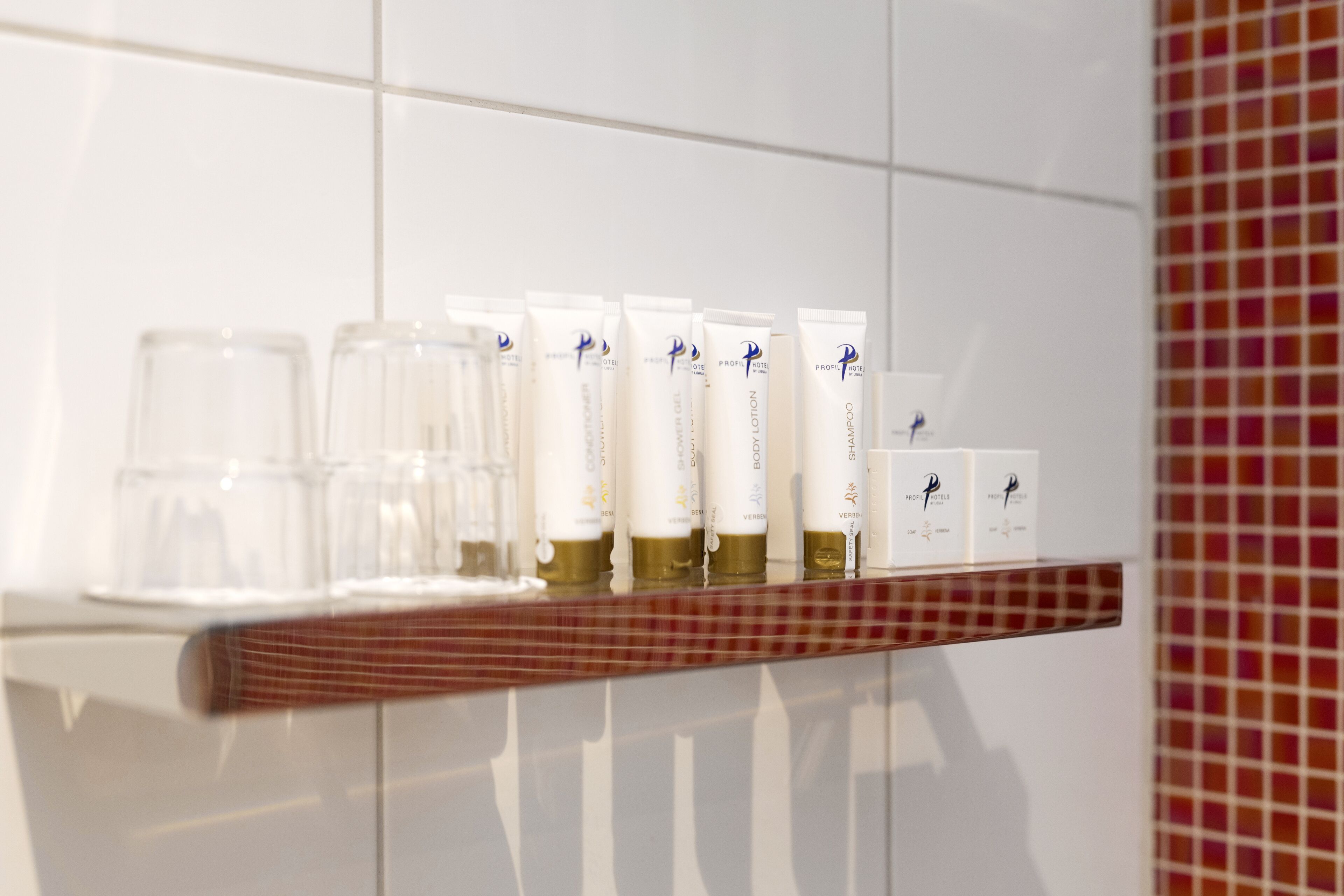 rainfall showerhead, eco-friendly toiletries, hair dryer, towels