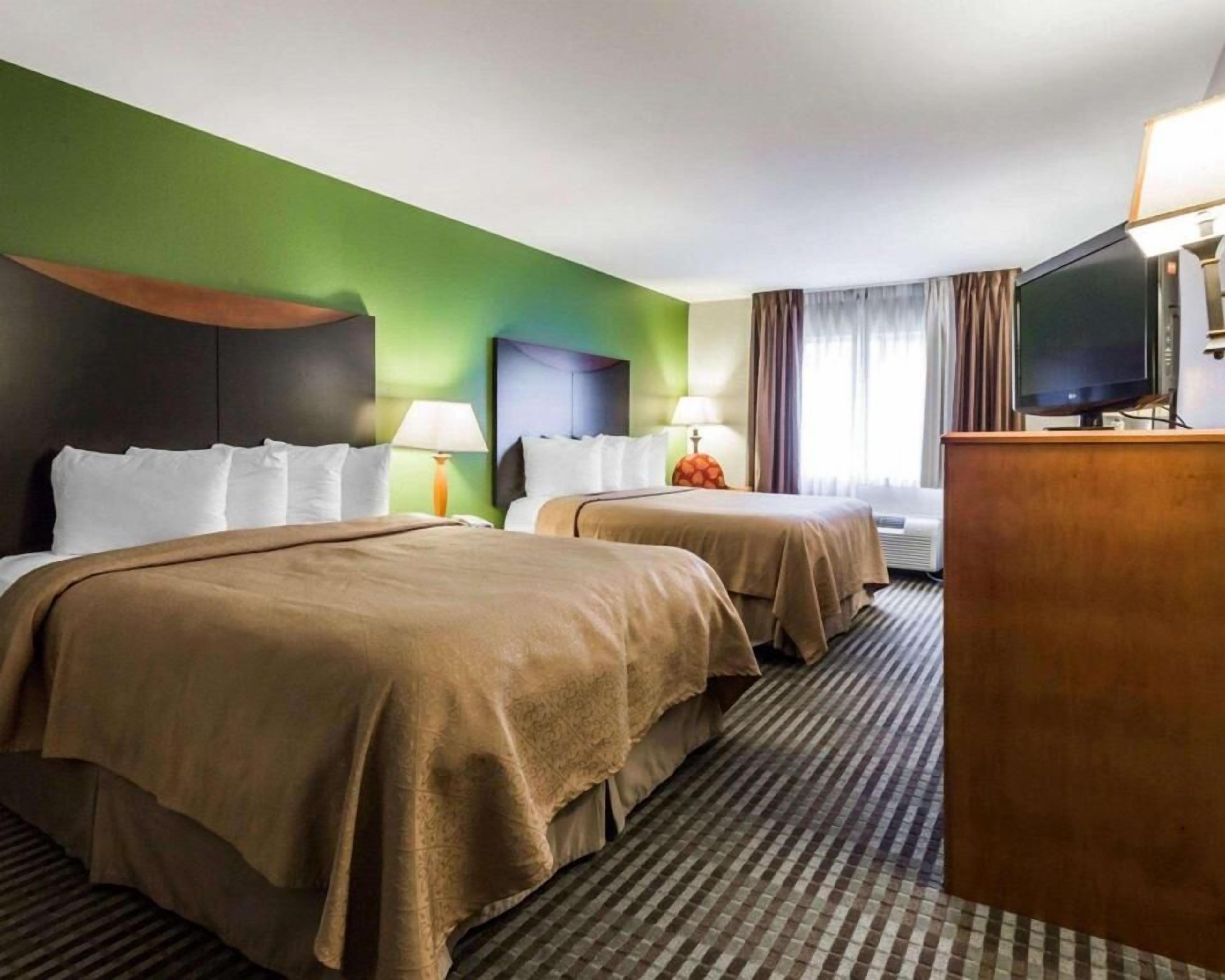 Premium bedding, pillowtop beds, desk, blackout drapes