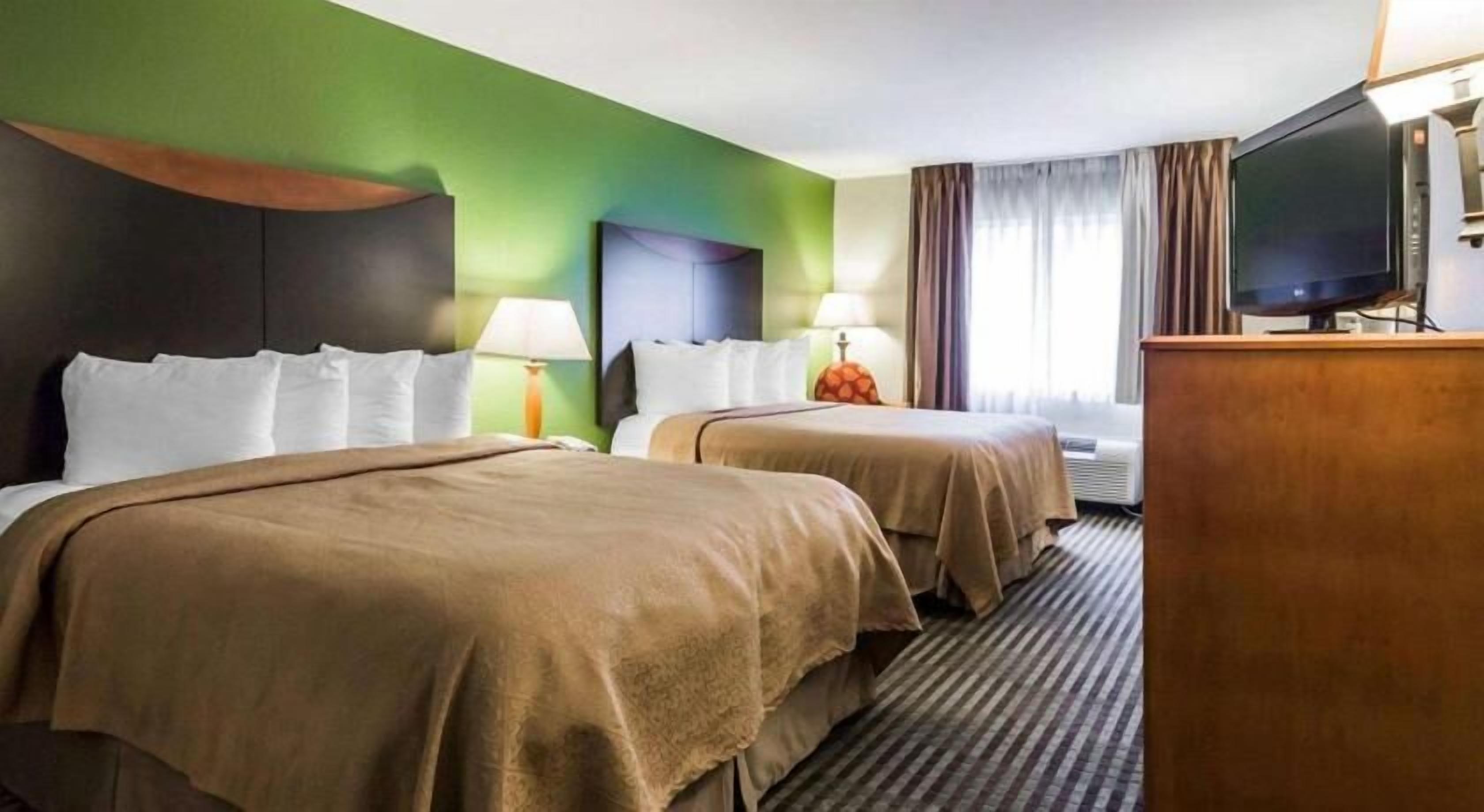 Premium bedding, pillowtop beds, desk, blackout drapes