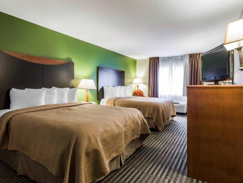 Premium bedding, pillowtop beds, desk, blackout drapes