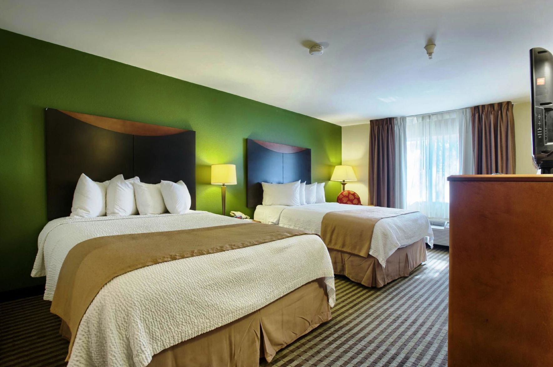 Premium bedding, pillowtop beds, desk, blackout drapes