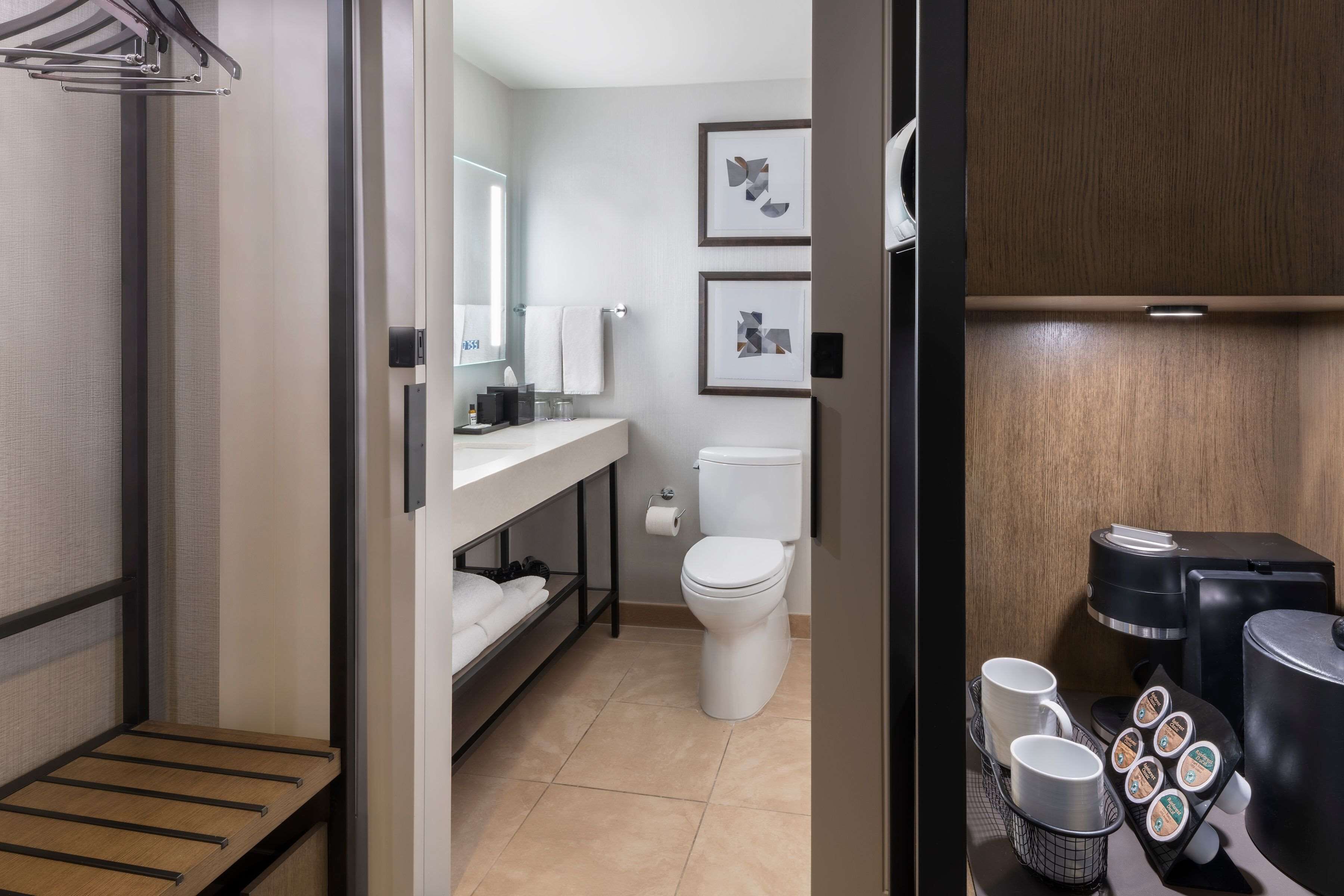 designer toiletries, hair dryer, bathrobes, towels