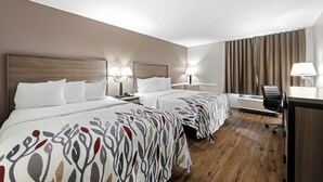 A hotel room with two beds, a desk, and a chair. - Red Roof Inn Gurnee - Waukegan (Waukegan)