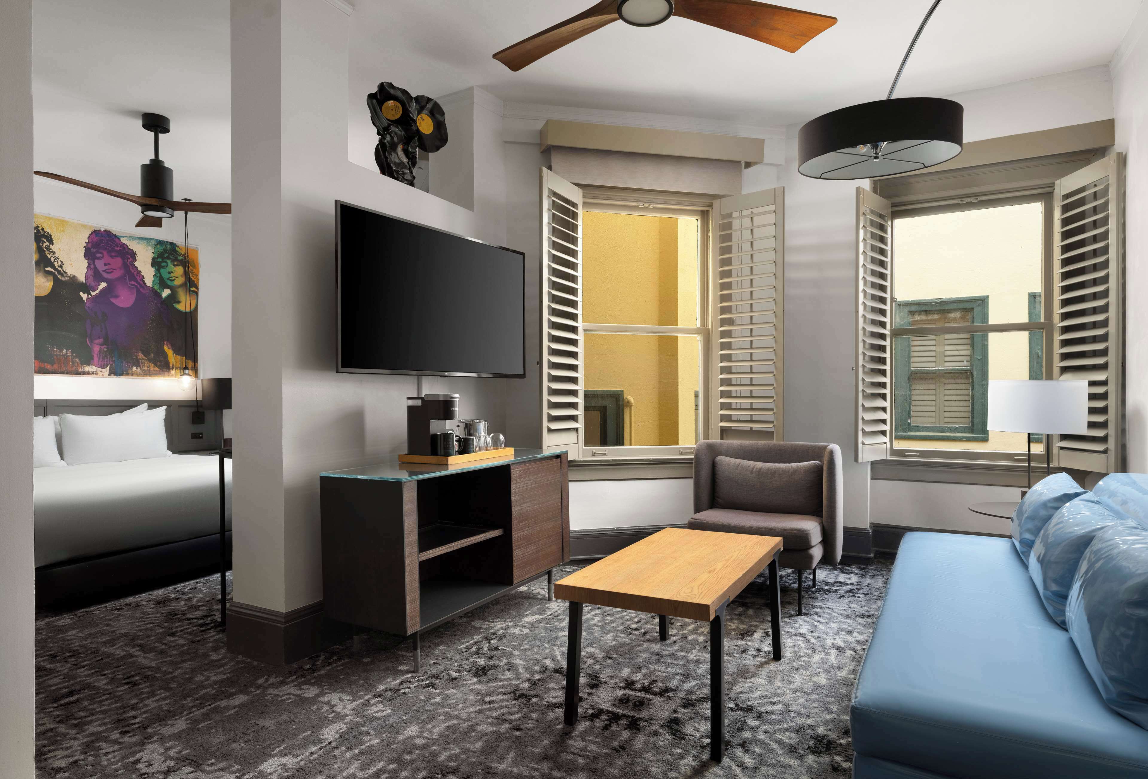 junior suite, 1 king bed with sofa bed | living area | 55-inch led tv with cable channels, tv, ipod dock