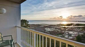 A balcony with a view of a coastal landscape during sunset. - Hampton Inn Mobile-East Bay/Daphne (Daphne)