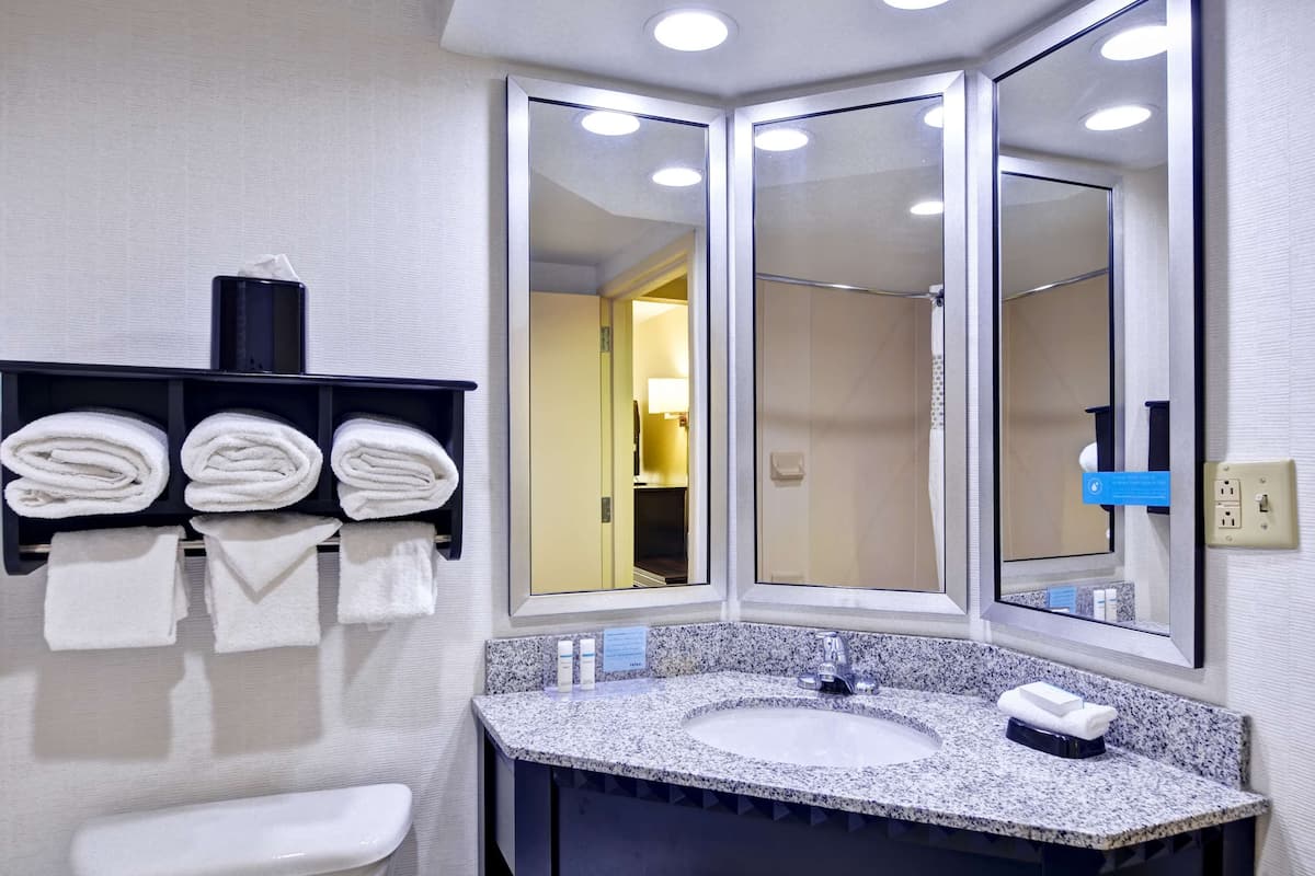 combined shower/bathtub, hair dryer, towels, soap