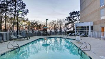 Outdoor pool, open 9:00 AM to 10:00 PM, pool loungers