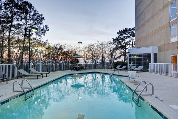 Outdoor pool, open 9:00 AM to 10:00 PM, pool loungers