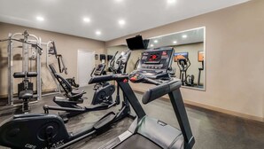 A gym with treadmills, elliptical machines, and weightlifting equipment. - Best Western Inn of Del Rio (Del Rio)