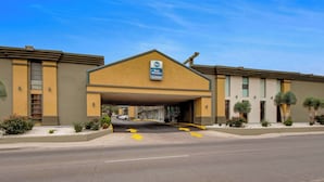 A Best Western hotel with a covered entrance, clear signage, and a parking lot with directional arrows. - Best Western Inn of Del Rio (Del Rio)
