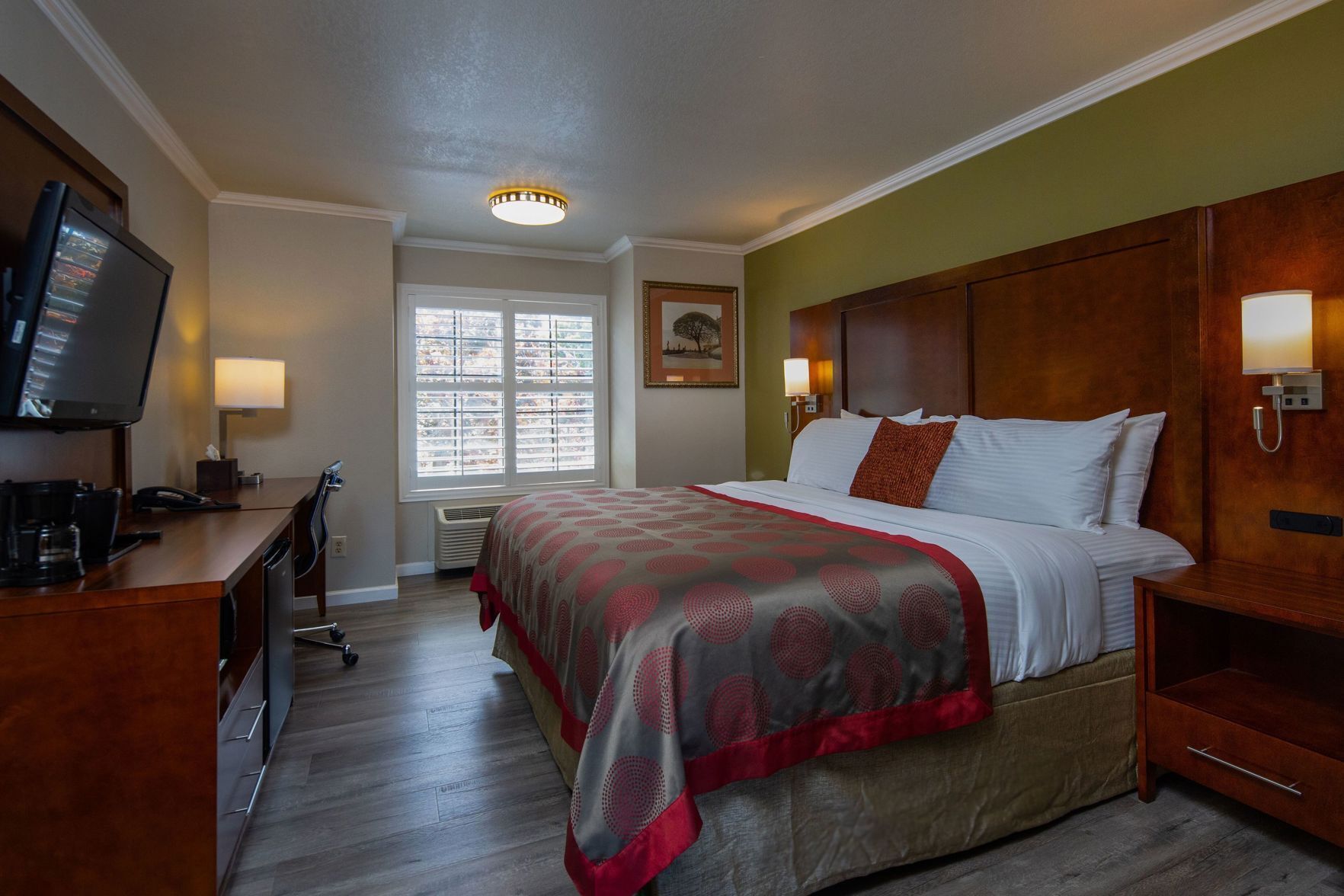 Premium bedding, desk, laptop workspace, blackout drapes