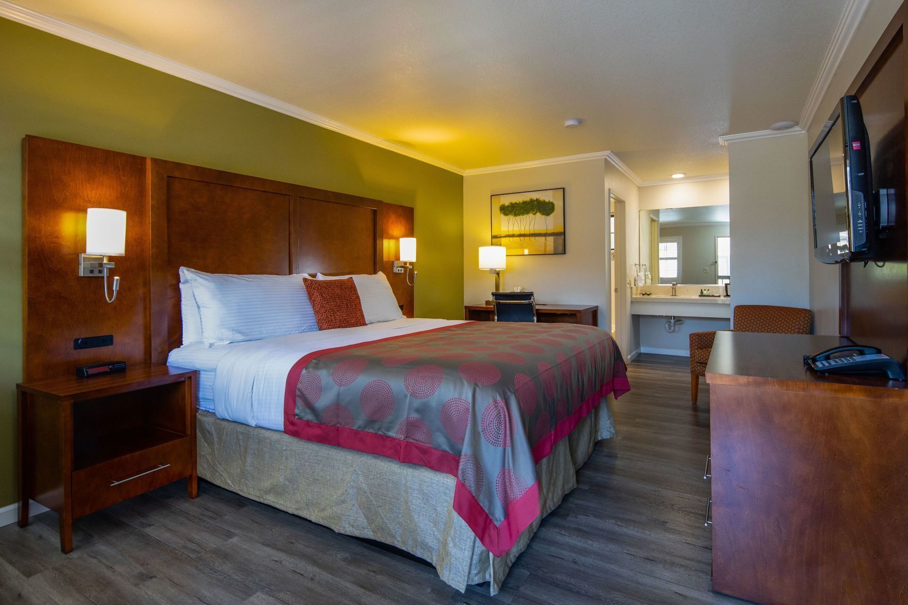 Premium bedding, desk, laptop workspace, blackout drapes