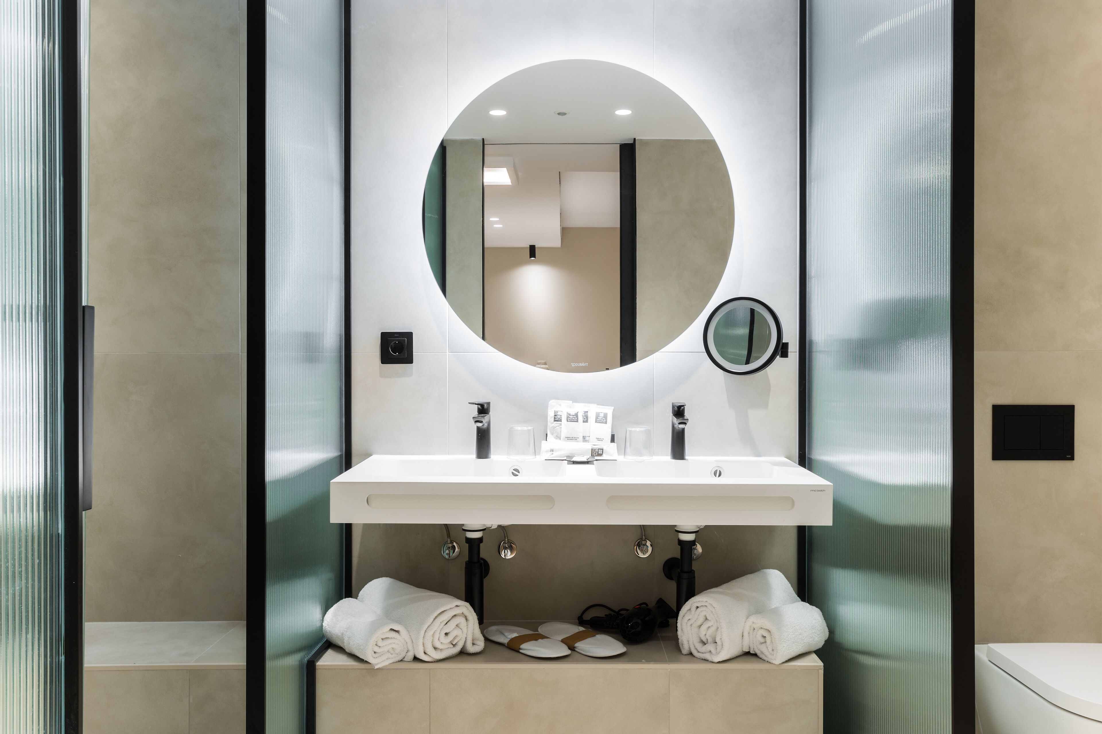 junior suite | bathroom | eco-friendly toiletries, hair dryer, slippers, towels