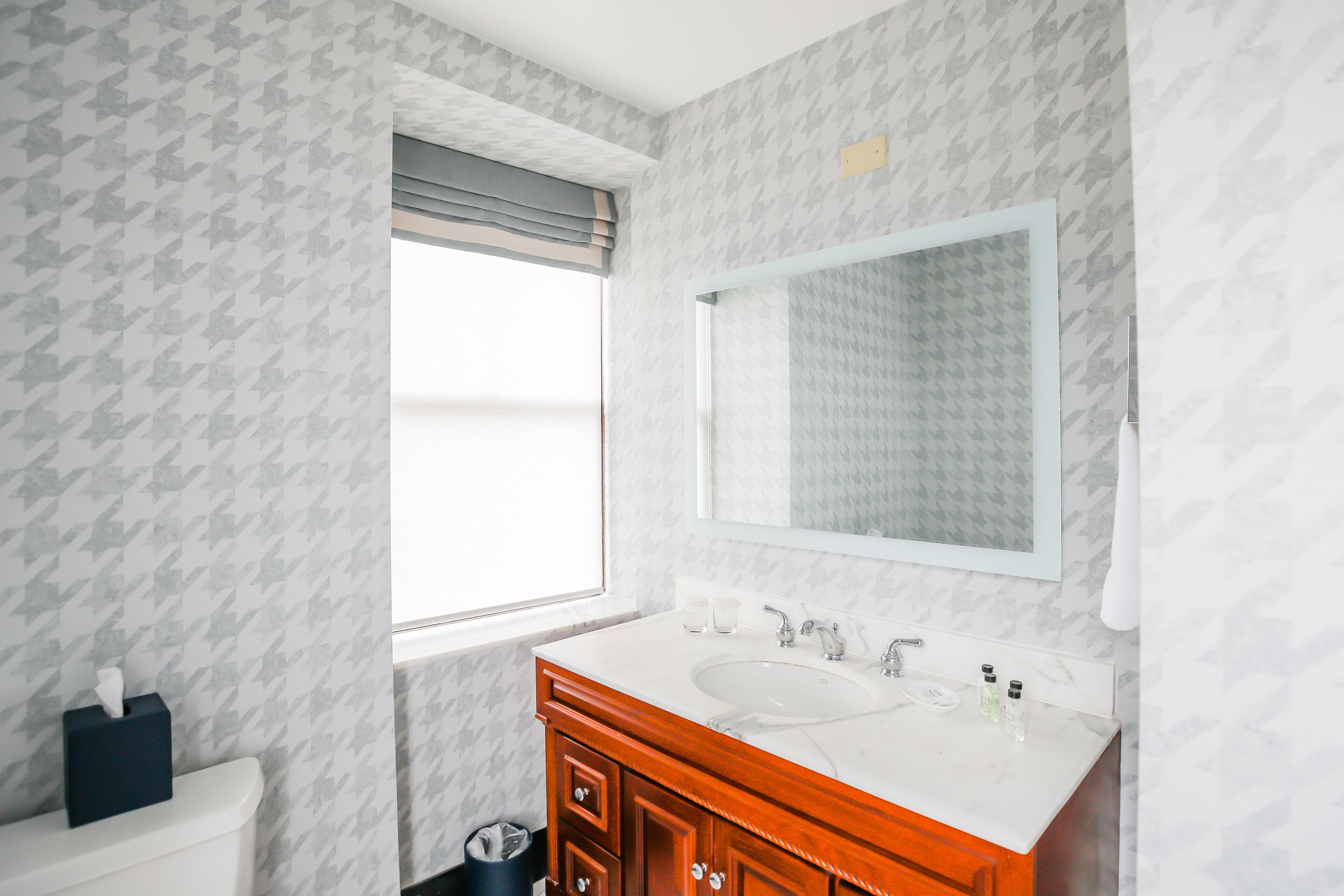 combined shower/bathtub, designer toiletries, hair dryer, bathrobes