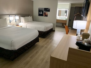 Hypo-allergenic bedding, desk, laptop workspace, blackout curtains