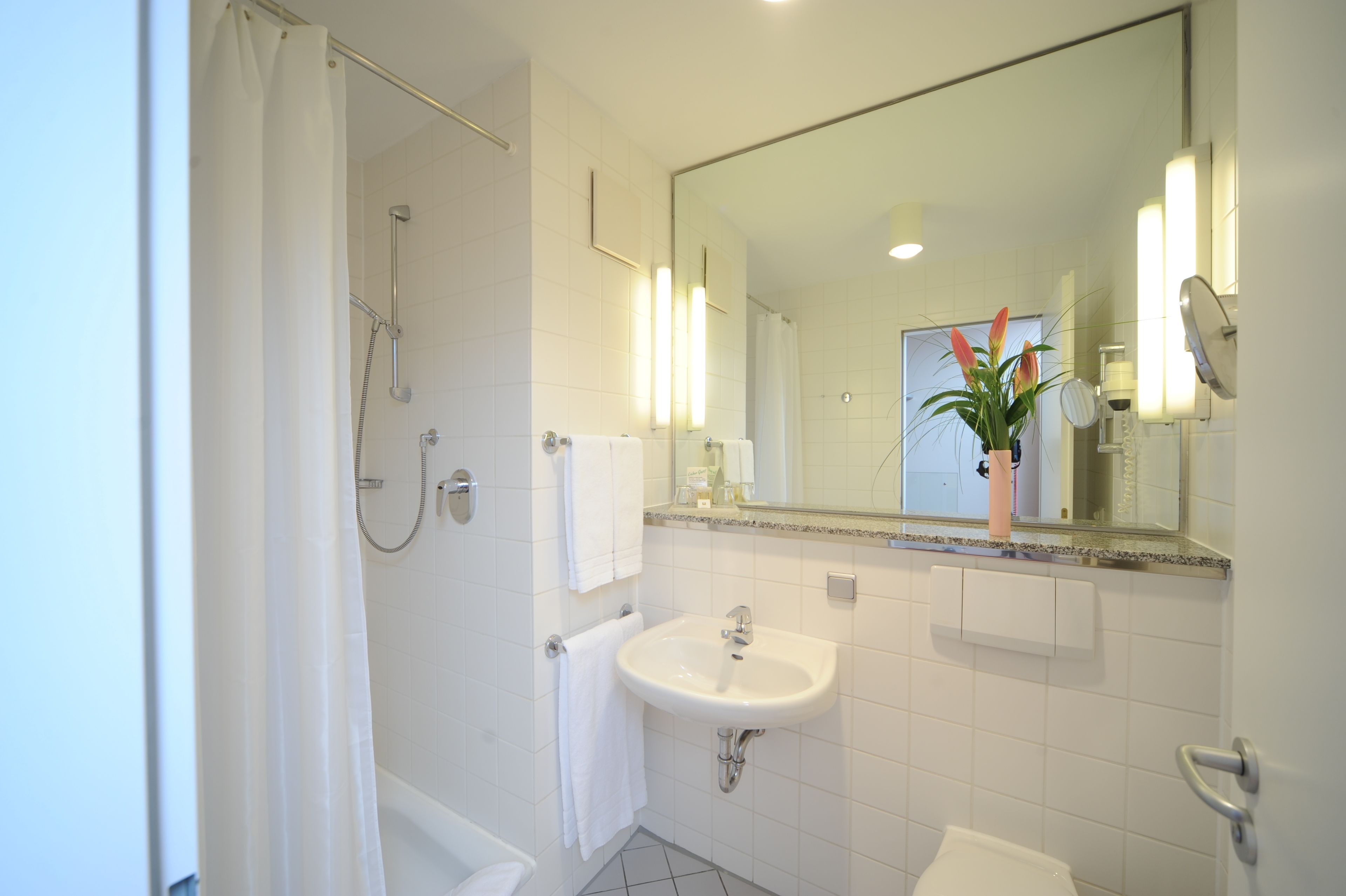 eco-friendly toiletries, hair dryer, towels