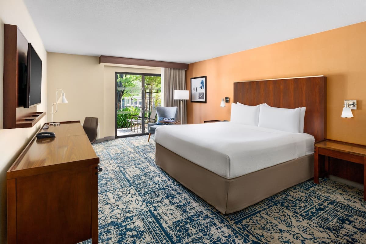 Premium bedding, desk, laptop workspace, iron/ironing board
