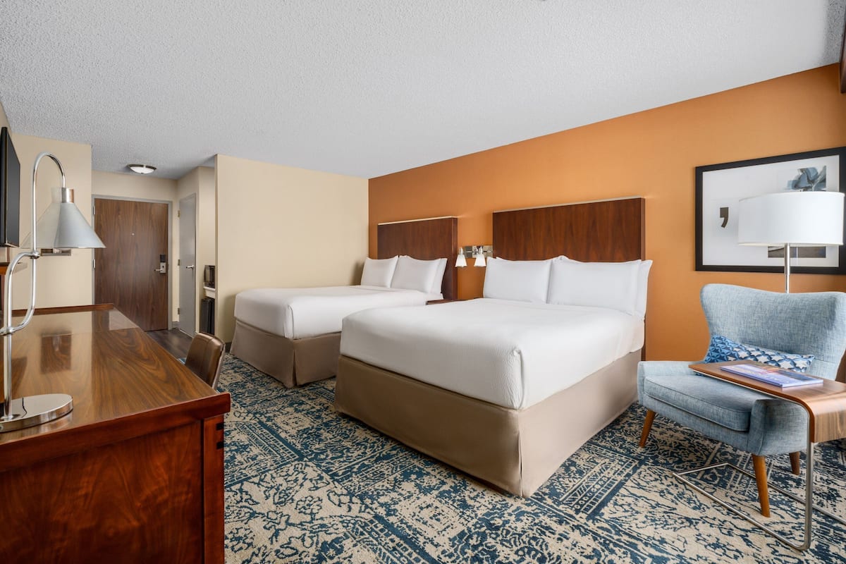 Premium bedding, desk, laptop workspace, iron/ironing board