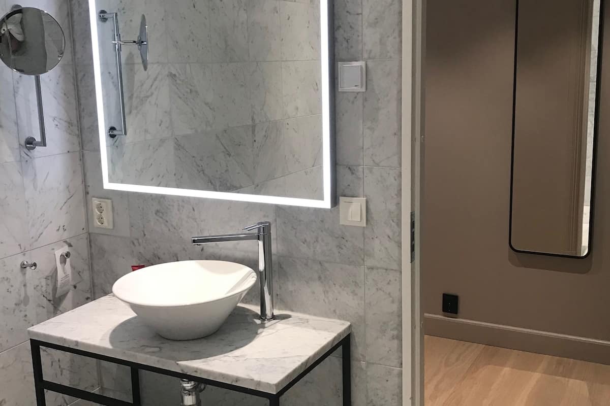 standard double no window - lilla hotellet | bathroom | eco-friendly toiletries, hair dryer, towels