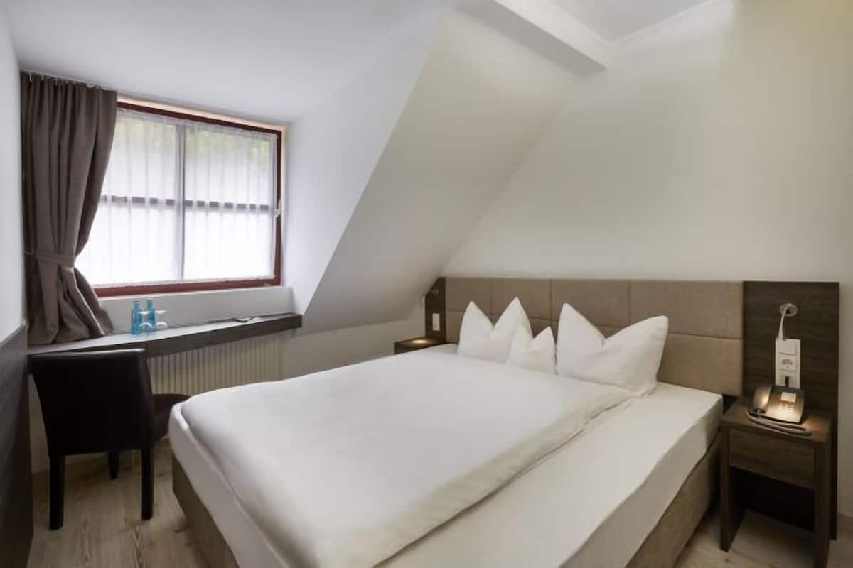 Premium bedding, pillow-top beds, desk, laptop workspace