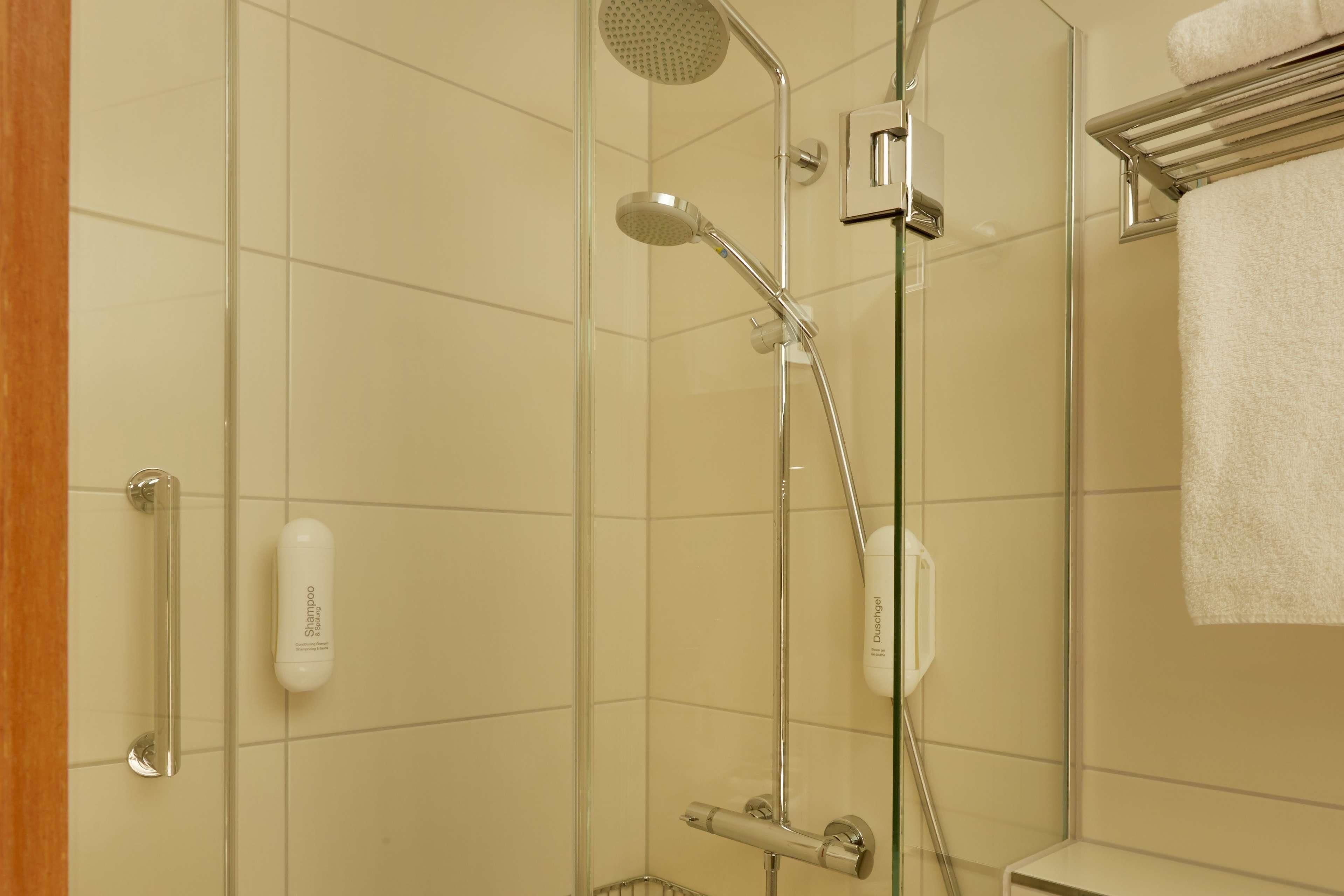 shower, eco-friendly toiletries, hair dryer, towels