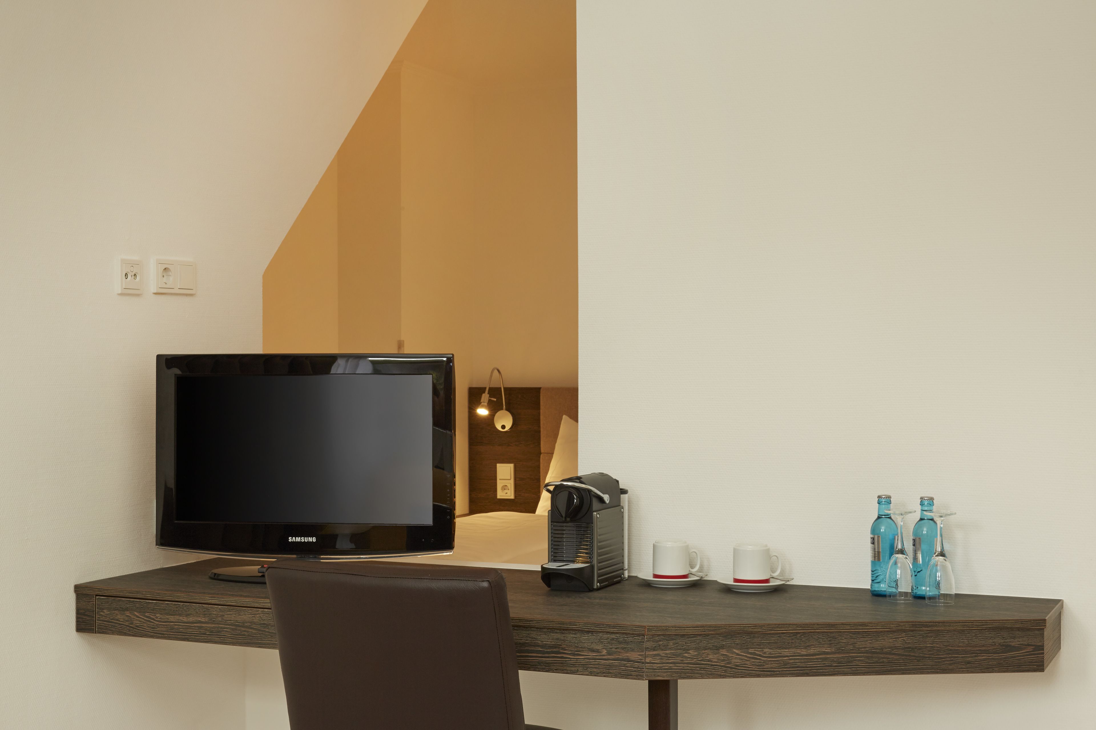 premium bedding, pillow-top beds, desk, laptop workspace