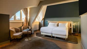 Camas con pillow-top, minibar y caja de seguridad en la habitación