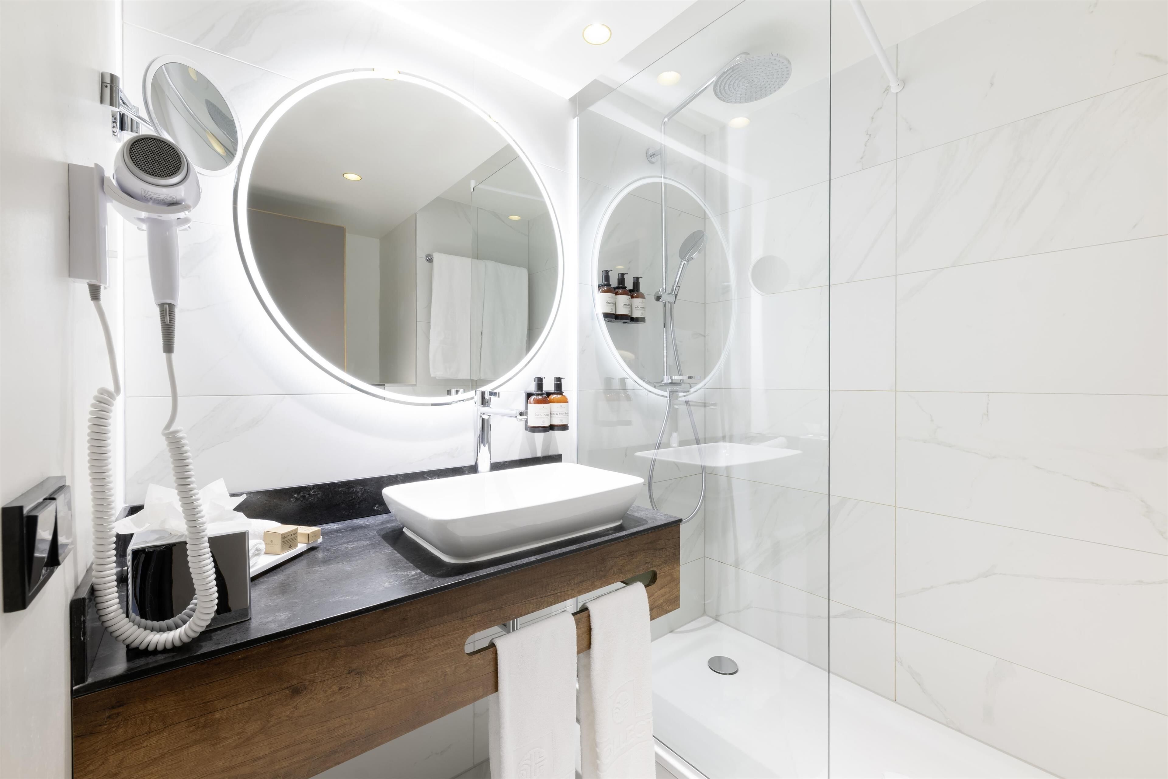 superior room | bathroom | shower, eco-friendly toiletries, hair dryer, towels