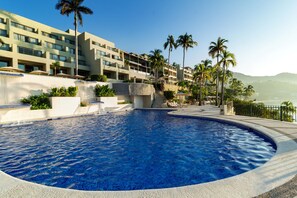 Outdoor pool, open 7:00 AM to 6:00 PM, pool umbrellas, sun loungers