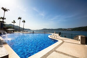 Outdoor pool, open 7:00 AM to 6:00 PM, pool umbrellas, pool loungers