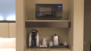 A compact kitchenette with a microwave, coffee maker, and a small refrigerator. - Holiday Inn Express Anderson by IHG (Anderson)