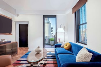 42-inch flat-screen TV with cable channels, Smart TV, iPod dock at The Benjamin Royal Sonesta New York