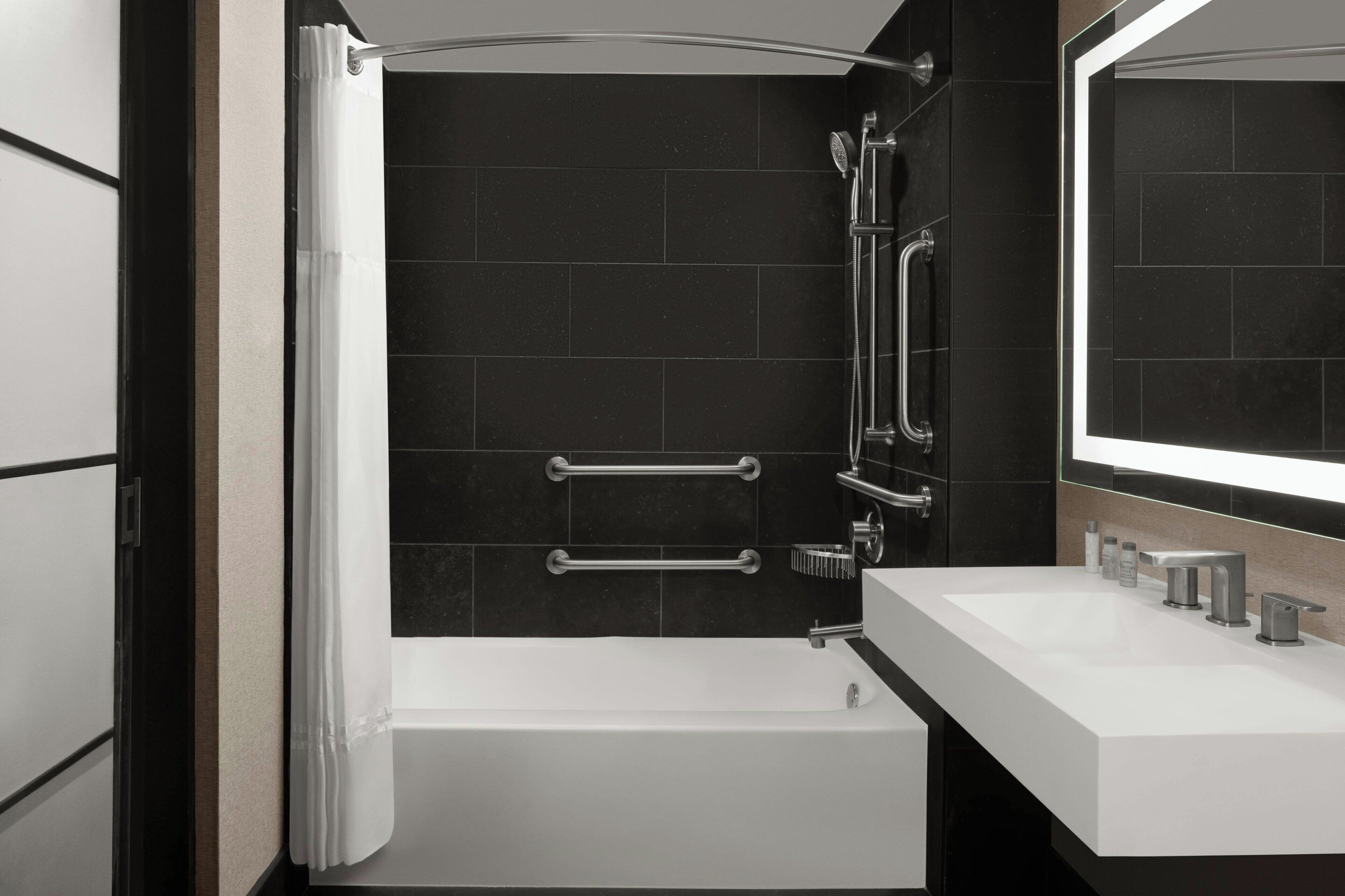 studio, 1 king bed, non smoking, corner | bathroom | designer toiletries, hair dryer, towels, soap