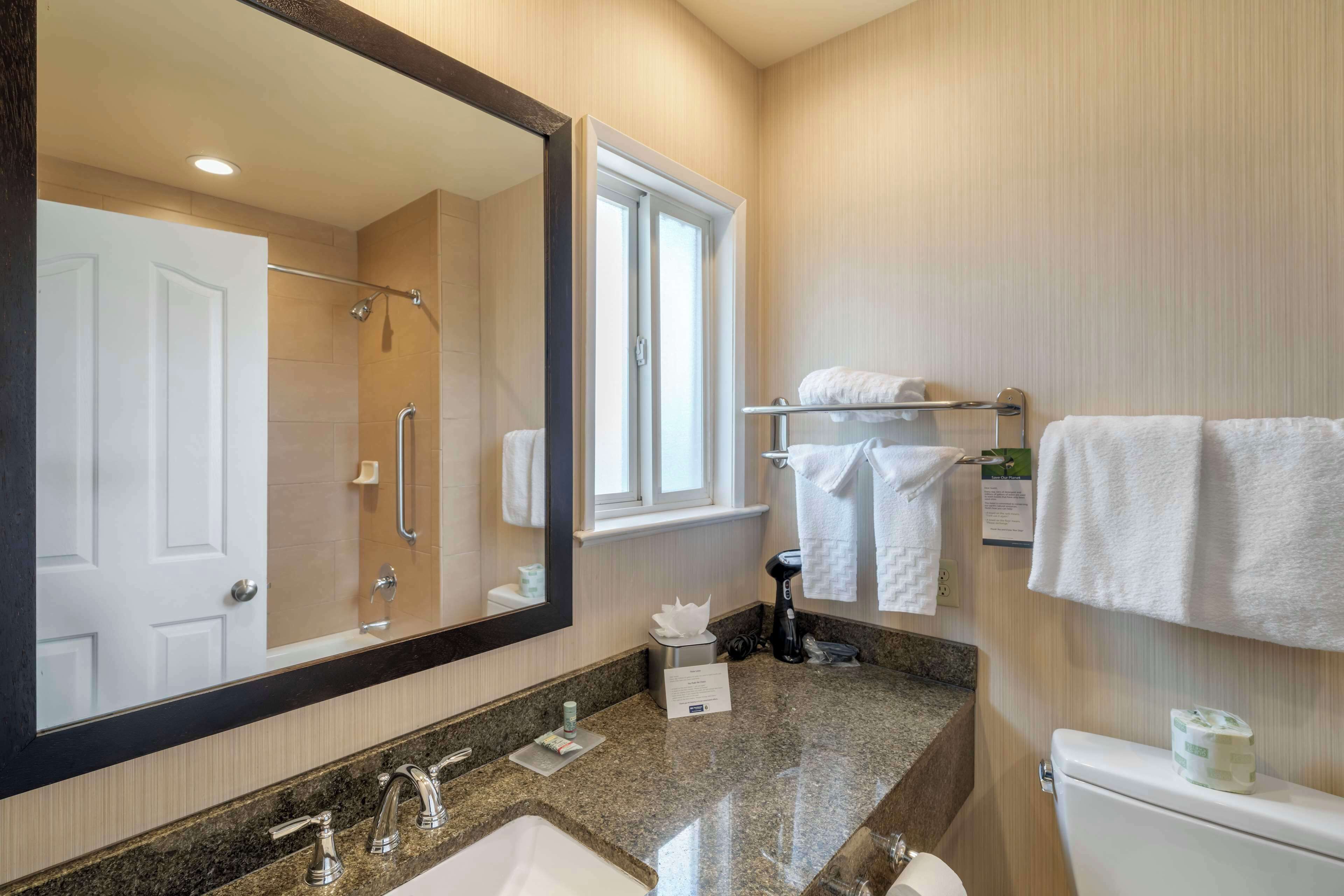 Shower, eco-friendly toiletries, hair dryer, towels