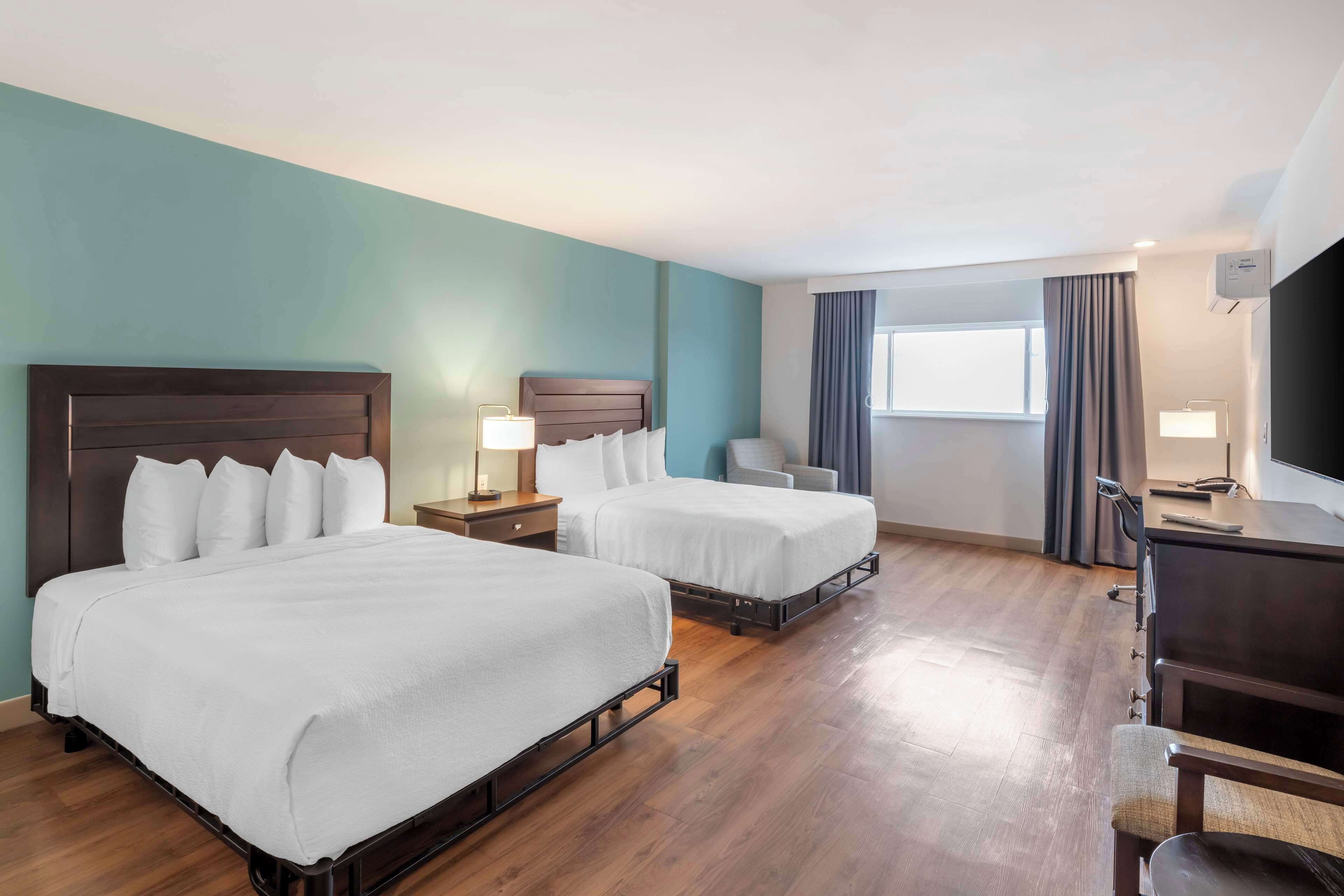 Desk, laptop workspace, iron/ironing board, free cribs/infant beds