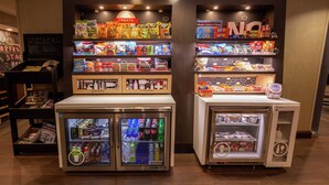 A vending machine area with snacks and drinks.
