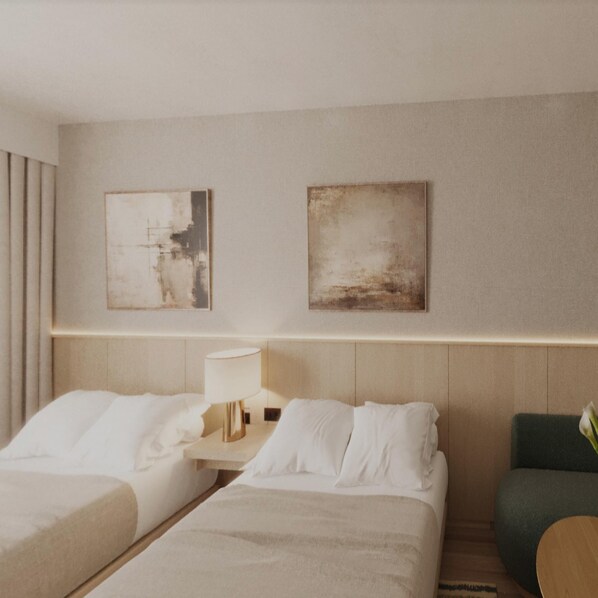 A hotel room with two beds, a nightstand with a lamp, and two abstract paintings on the wall.