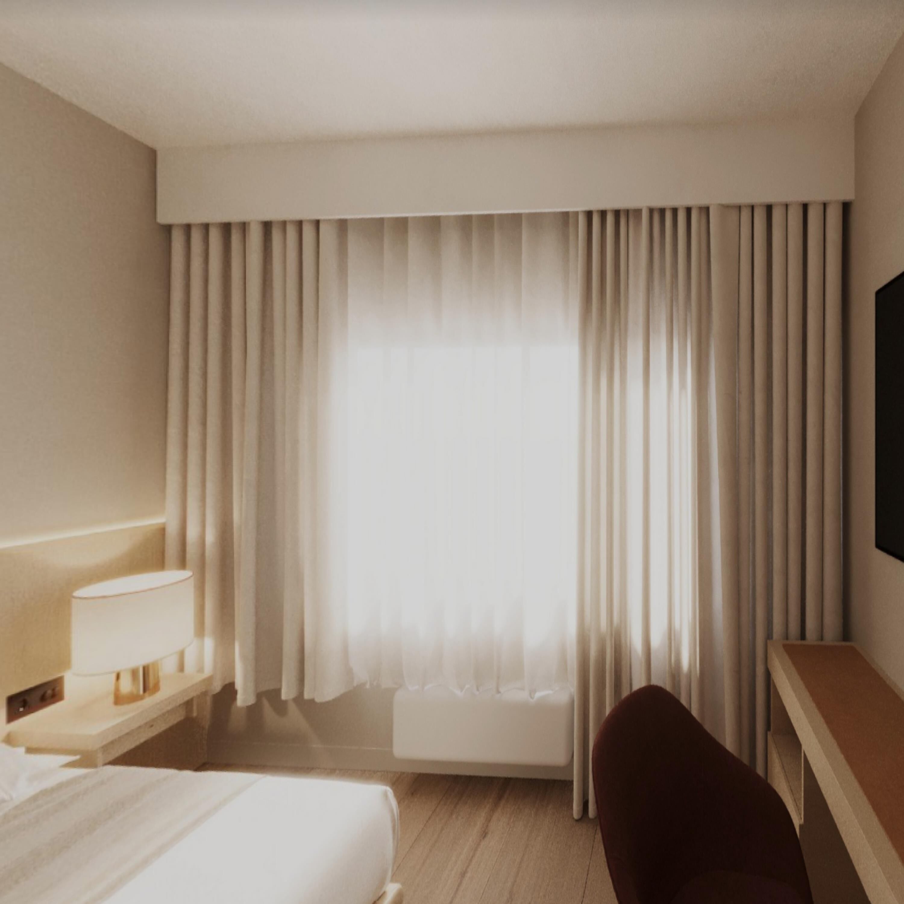 A hotel room with a bed, a desk, a chair, a lamp, and a large window with curtains.