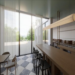 A dining area with a checkered floor, large windows with sheer curtains, and a long counter with chairs. - DoubleTree by Hilton Wilkes-Barre (Wilkes-Barre)