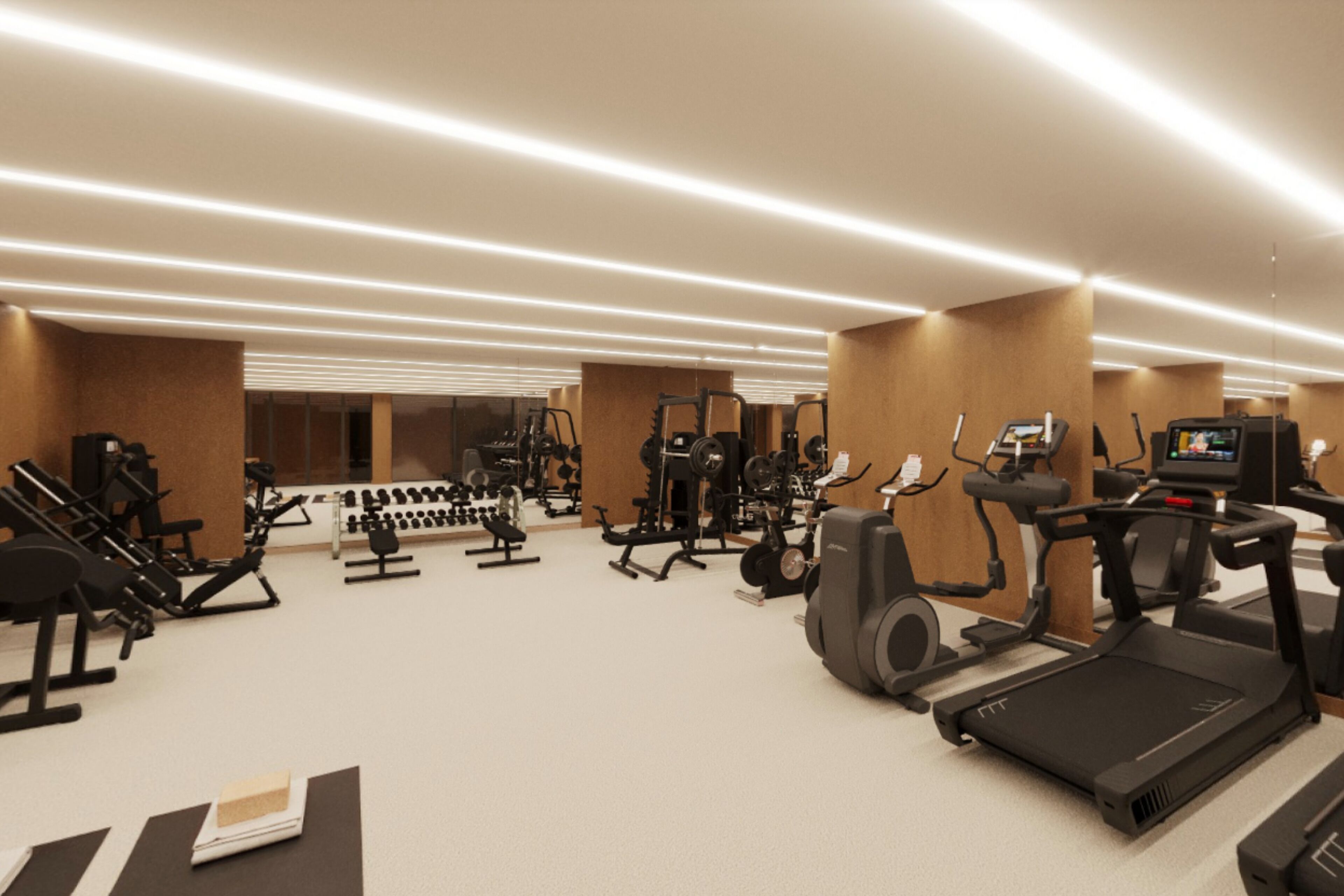 A modern gym with various exercise equipment, including treadmills, weight machines, and a television screen.