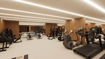 A modern gym with various exercise equipment, including treadmills, weight machines, and a television screen.