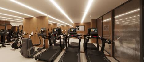 A gym with treadmills, elliptical machines, and weight equipment.